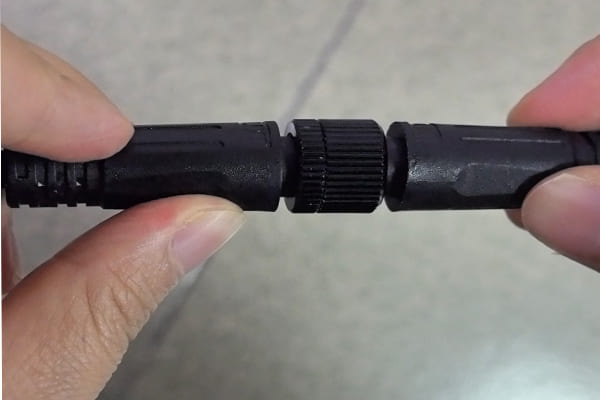 A close-up of a waterproof LED lighting connector